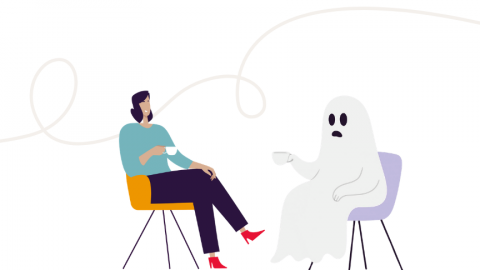 Twee figuren zitten tegenover elkaar, een persoon en een cartoonachtig spook, in een minimalistische setting.